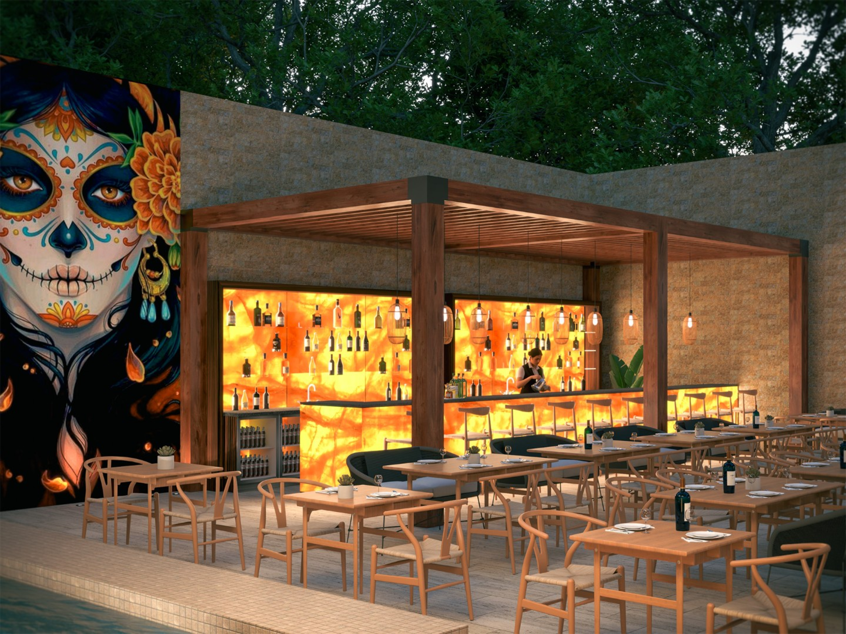 An outdoor restaurant bar with a glowing backlit counter, wood pergola, and rows of dining tables. A large colorful mural decorates one wall, with warm lighting and greenery creating an inviting evening atmosphere.