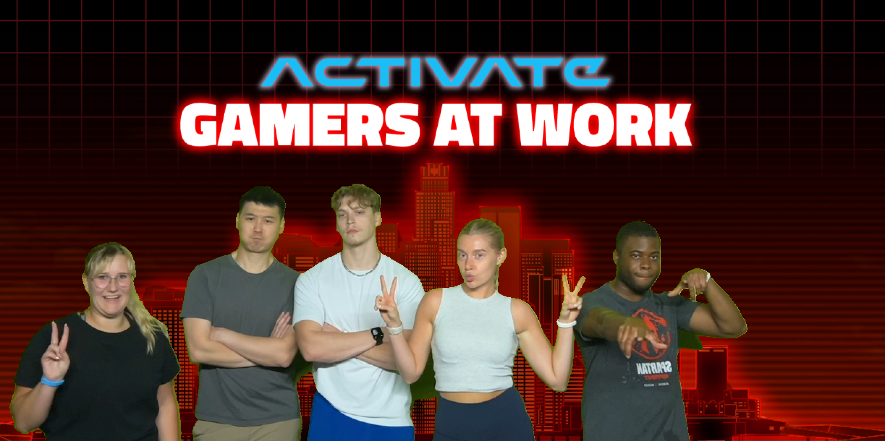 A graphic titled “ACTIVATE: GAMERS AT WORK” shows five people standing in a row and posing in front of a red, grid‑style city skyline background with bold, stylized text at the top.