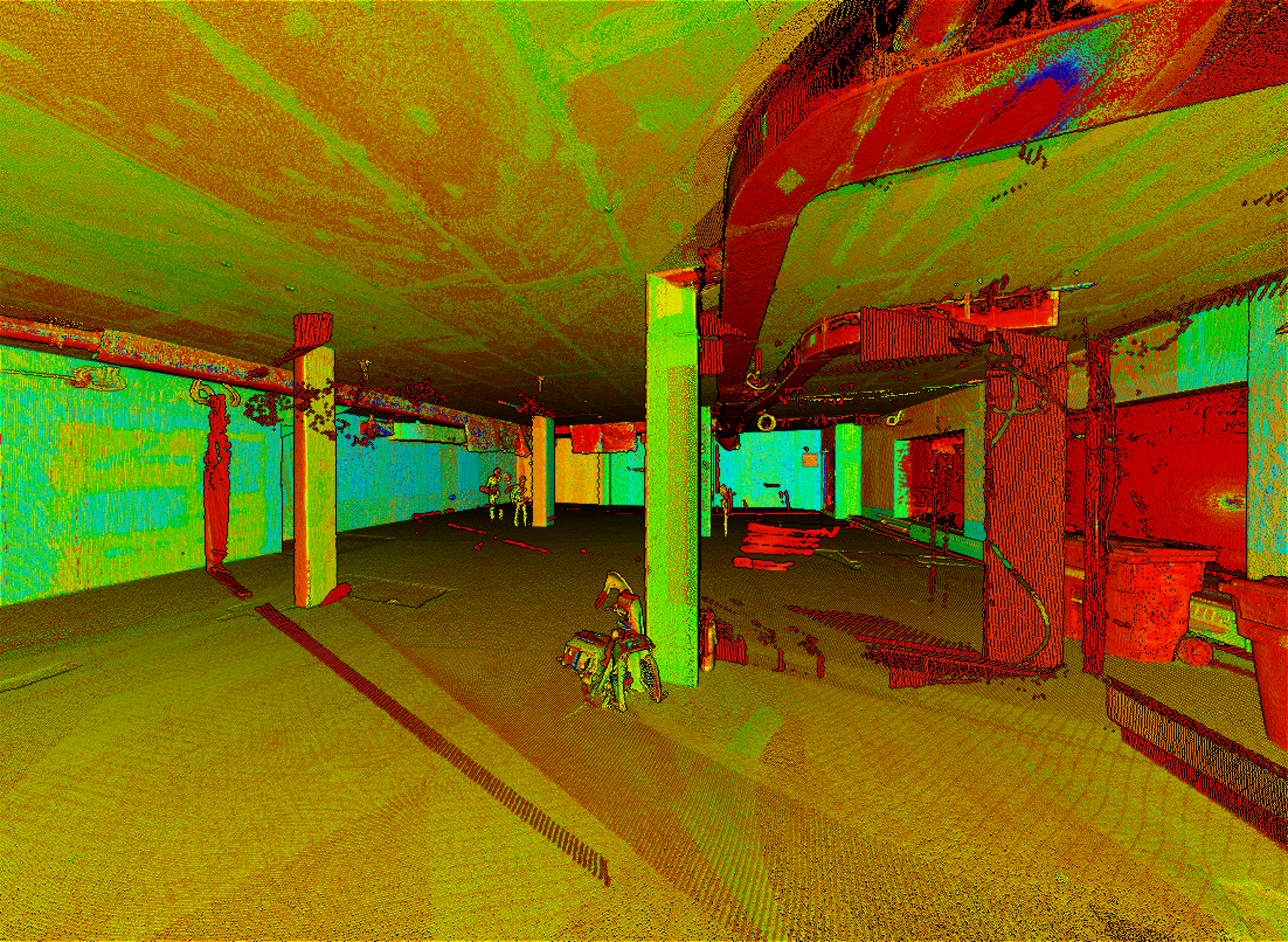 A color‑mapped 3D scan of a building interior shows columns, walls, and ceiling surfaces highlighted in green, red, and yellow. The point‑cloud view emphasizes structural layout and spatial depth against a dark background.