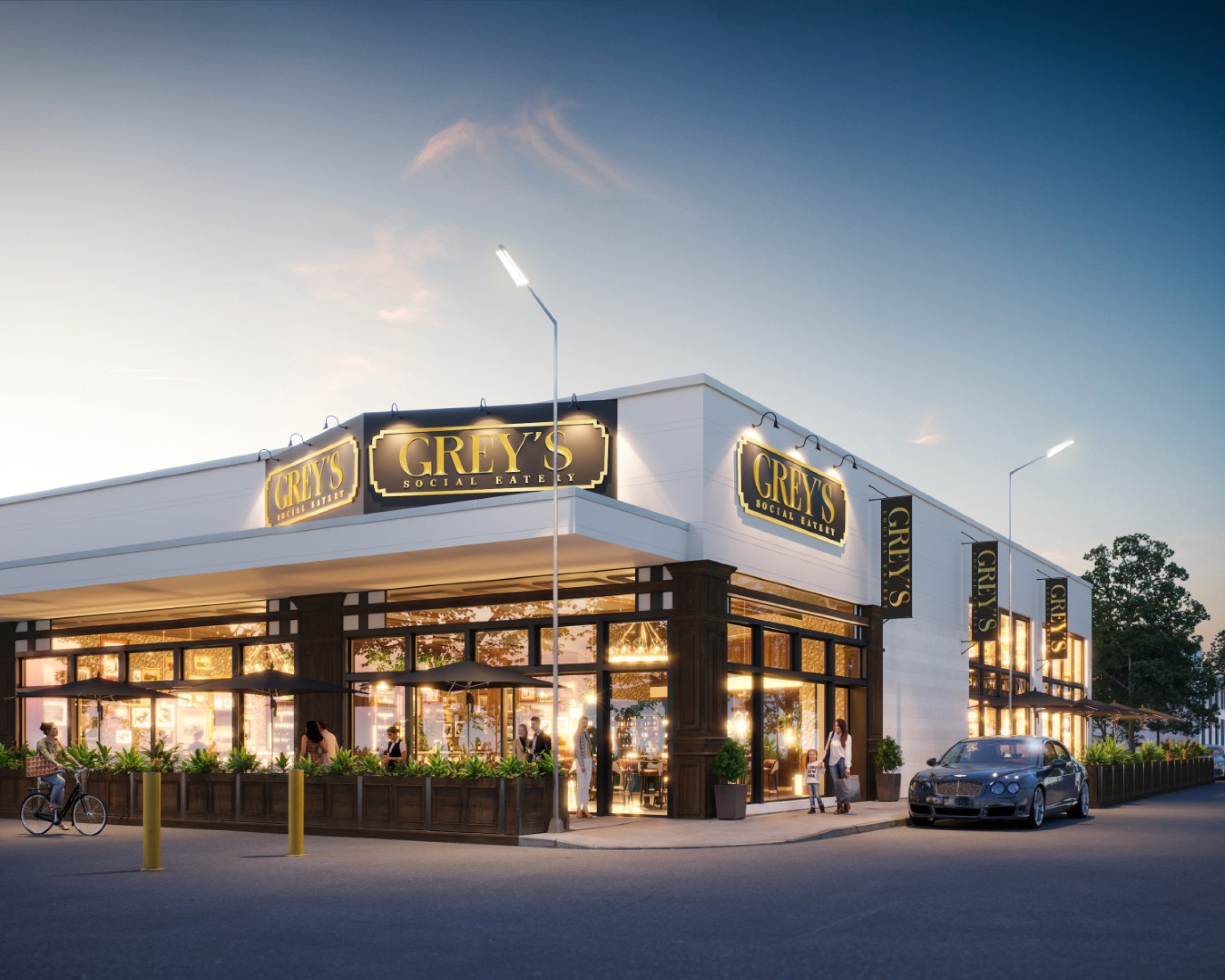 A corner restaurant building with white walls, large glass windows, and black trim illuminated at dusk. Multiple signs read “GREY’S SOCIAL EATERY,” with outdoor seating, pedestrians, and parked cars along the street.