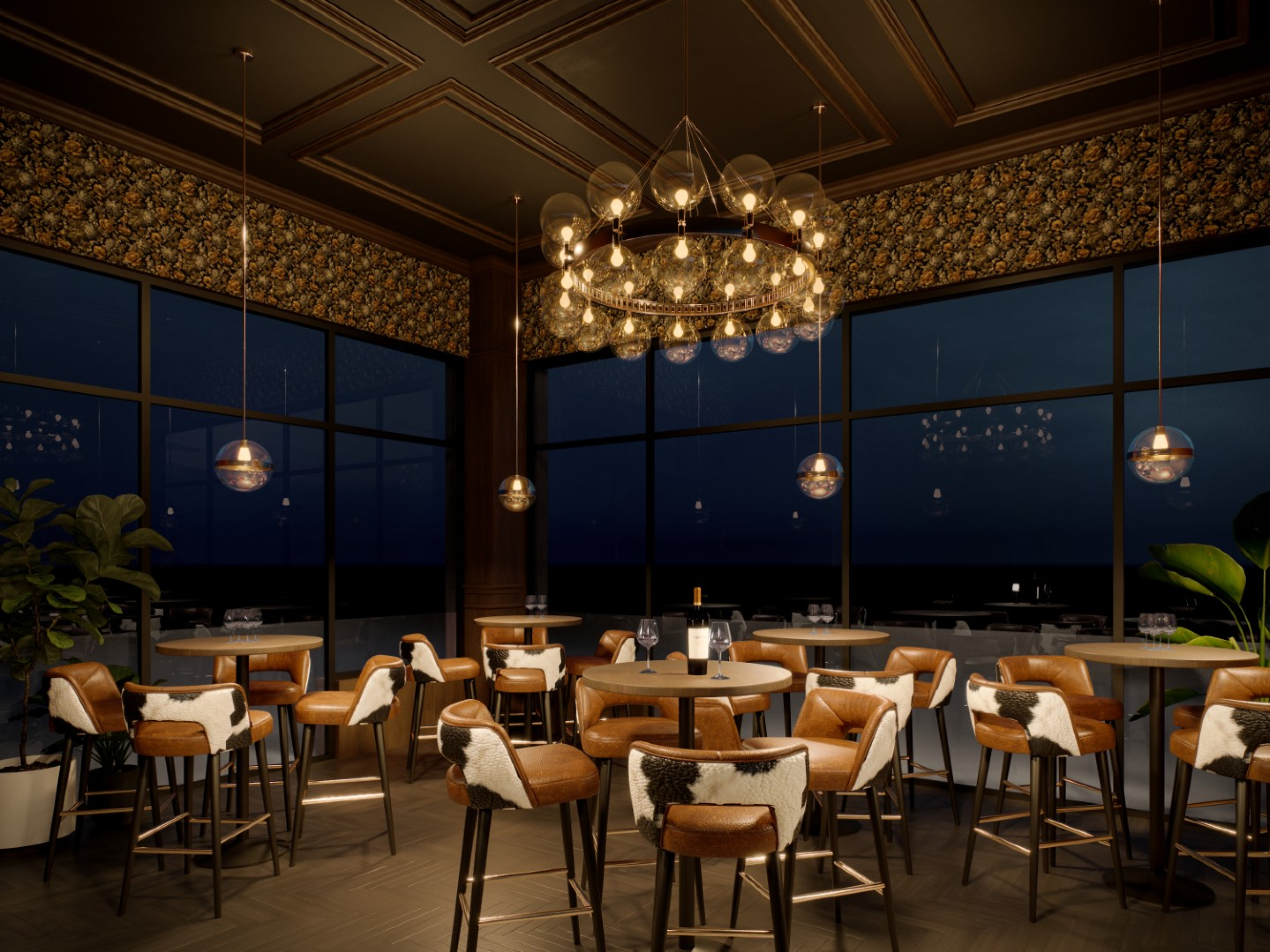 An elegant restaurant dining area with round tables and leather bar‑height chairs set beneath a circular glass chandelier. Large windows reveal a night sky, while patterned wall panels and warm lighting create an upscale atmosphere.