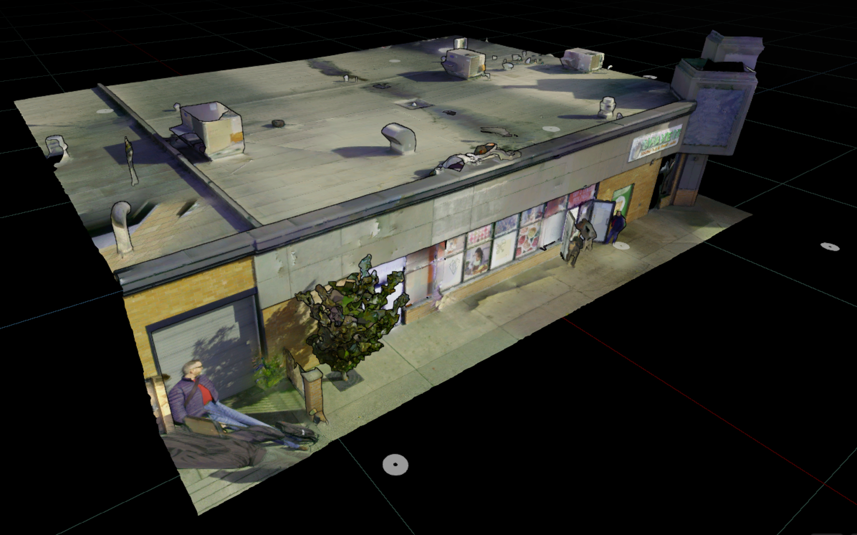 A textured 3D scan model of a single‑storey commercial building is shown from an elevated angle. Roof details, storefront windows, sidewalk, and nearby landscaping are visible against a dark background.