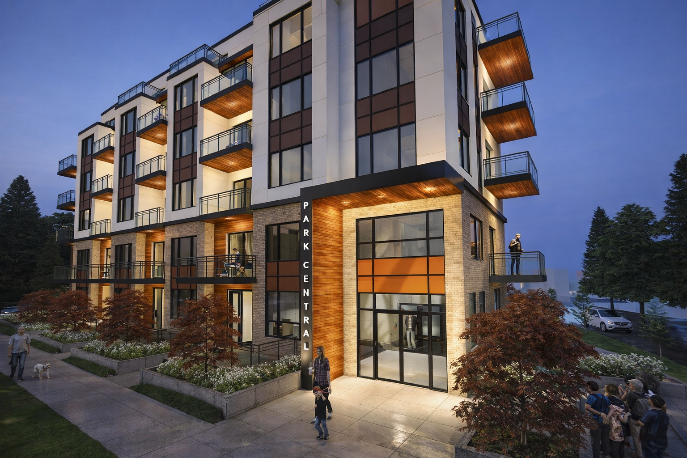 A rendered evening view of a mid‑rise residential building with stacked balconies, large windows, and warm interior lighting. A corner entrance labeled “Park Central” fronts a landscaped sidewalk with trees and pedestrians.